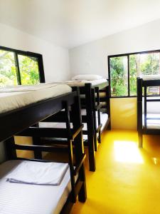 Postel nebo postele na pokoji v ubytování Amalaya Hostel
