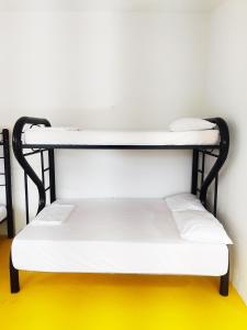 Postel nebo postele na pokoji v ubytování Amalaya Hostel