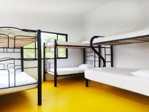 Postel nebo postele na pokoji v ubytování Amalaya Hostel