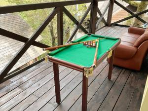 a pool table on a deck with a couch at minpaku hotaru - Vacation STAY 65549v in Takamatsu