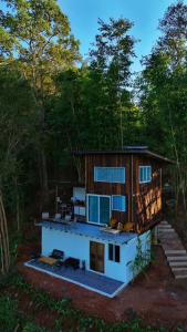 a house in the middle of a forest at บ้านเล็กในป่าใหญ่ at น่าน Little House In the Forest at Nan 