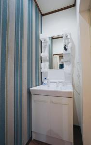 Vannituba majutusasutuses North Tengachaya Hotel Apartment