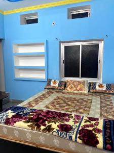 Cama ou camas em um quarto em Garuda Guest House