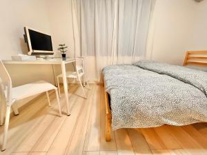 Postel nebo postele na pokoji v ubytování ティエラ北池袋