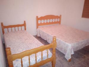 Ένα ή περισσότερα κρεβάτια σε δωμάτιο στο Chácara do vô Meireles +33 φωτογραφίες