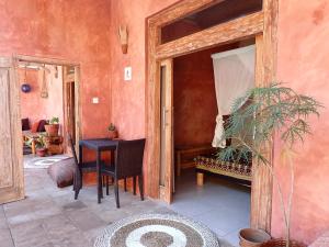a room with a table and a bench in a room at Villa Sea La Vie Private pool in Gili Meno