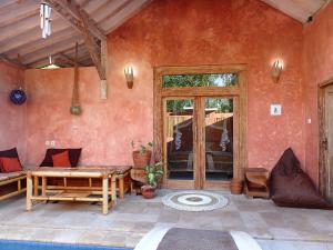a living room with a couch and a table at Villa Sea La Vie Private pool in Gili Meno