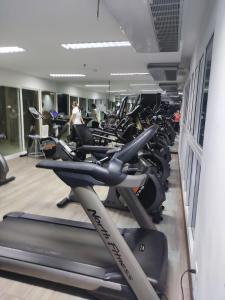 a gym with a lot of cardio machines at The Prio Condo in Chiang Mai