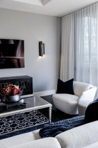 a living room with a couch and a coffee table at Balmoral on Scott - Harbour Front Perfection in Newcastle