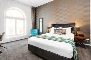 Katil atau katil-katil dalam bilik di Hotel 115