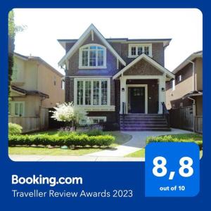 a house with a sign that says travel review awards at Cozy Guest Suite in Quiet Home with Private Entry in Vancouver