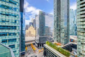 an aerial view of a city with tall buildings at Downtown Toronto APT in Toronto