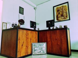 a room with two wooden cabinets with a picture on the wall at Royal Bath Edge in Kandy