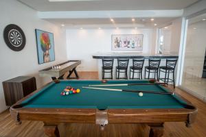 a pool table in a room with a bar at Andersson Beach House Cebu in Compostela
