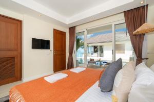 Ένα ή περισσότερα κρεβάτια σε δωμάτιο στο Stunning 5 bedrooms Villa with Panoramic Sea View +50 φωτογραφίες