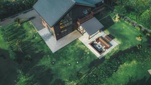 an overhead view of a house with a yard at Cairns House by SANA in Tateyama