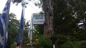 
a sign that is on top of a tree at Edelweiss Hotel in Platres
