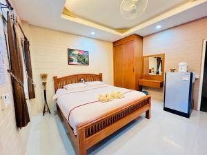 Postel nebo postele na pokoji v ubytování Benwadee Resort Pattaya