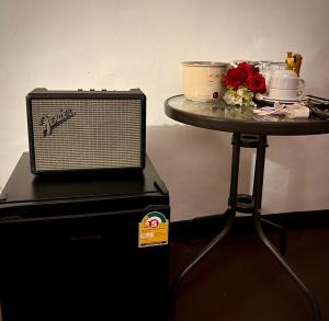 a table with a laptop on top of a table at บ้านริมน้ำ สำหรับครอบครัว in Buriram