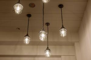 a group of lights hanging from the ceiling at Saturn Hotel in Taichung