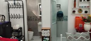 a small bathroom with a toilet and a sink at 6 Guest - Unit 2 Studio type in Santa Rosa