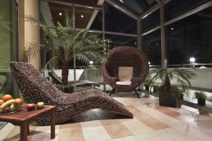 a lobby with a pair of high heels and chairs at Flamingo Grand Hotel & Spa in Albena