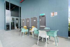 a group of tables and chairs in a building at 3Towers @ KL City Centre in Kuala Lumpur