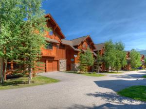 a driveway in front of a log home at Black Eagle 10 in Big Sky