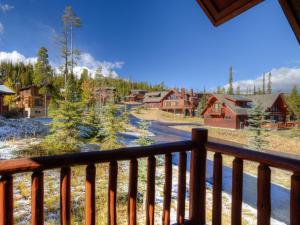 a view of a town from the balcony of a cabin at Powder Ridge Cabin Rosebud 24 in Big Sky