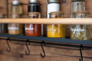 a shelf filled with different types of spices at Pretty Jolie Romantic Getaway in Bled