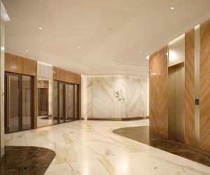 a lobby of a building with marble floors and walls at LIVINGSTON GRAND RESORT & SPA in Casablanca
