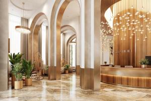 a lobby of a hotel with a chandelier at LIVINGSTON GRAND RESORT & SPA in Casablanca