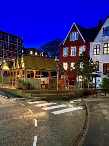 a building with christmas lights on the side of a street at Luxury New Cozy and Quietly 95m2 in Tórshavn