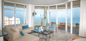 a living room with a view of the ocean at 801 Oyster Schelles - by Stay in Umhlanga in Durban