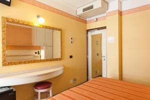 Postel nebo postele na pokoji v ubytování Hotel Flamingo