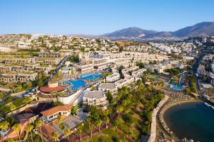 an aerial view of a resort with a beach at Selectum Colours Bodrum in Gümbet