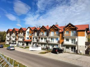 Budova, v ktorej sa apartmán nachádza + 7 fotografií
