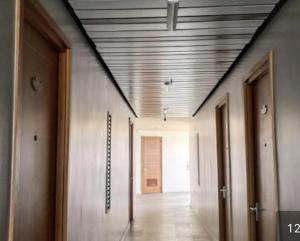 an empty hallway with a ceiling in a building at Antara Condominium Residences in Talisay