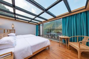 Fotografie z fotogalerie ubytování Zhangjiajie Qiquan Vacation B&B v destinaci Čang-ťia-ťie