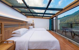 Fotografie z fotogalerie ubytování Zhangjiajie Qiquan Vacation B&B v destinaci Čang-ťia-ťie