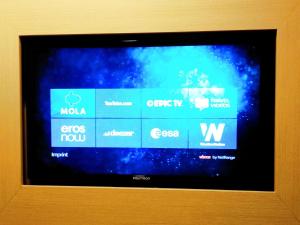 a television screen with the icons of different computers at Jakarta City Hotel in Jakarta