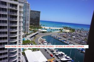 a view from the floor of a building with a marina at Waikiki Studio at Ilikai Marina - great apartment by the beach - see low end price! in Honolulu
