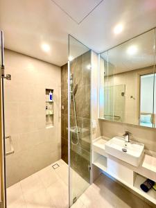 a bathroom with a sink and a shower at The Song Premium Apartment in Vung Tau
