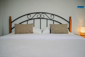 Postel nebo postele na pokoji v ubytování ไร่นภาดลรีสอร์ท