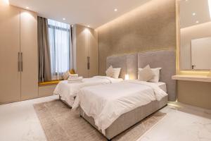 Postel nebo postele na pokoji v ubytování Amber Hospitality - Al Qairawan