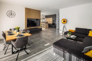 a living room with a couch and a table at Villa A in Bilice