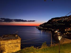 a view of the ocean at night at TakeAmalfiCoast Patchwork Rural House in Minori