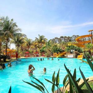 a group of people in a swimming pool at a resort at Barretos Thermas Resort in Barretos