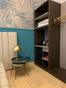 a room with a table and a chair and a cabinet at Spazio SIMA Space 2 - 1 in Milan
