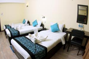 Letto o letti in una camera di Bag Packer's Lodge